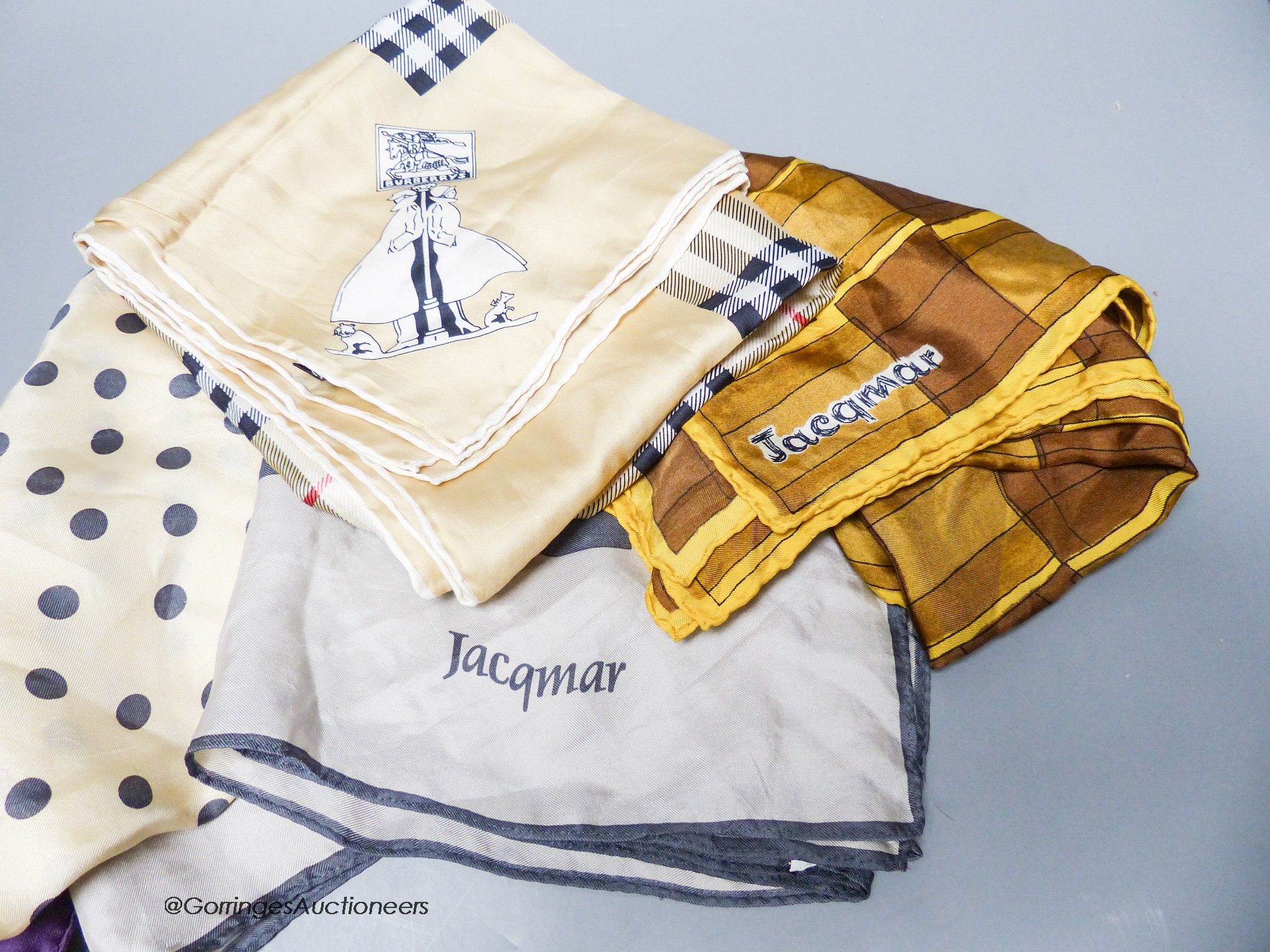 Four silk scarves including Hermes and Burberry